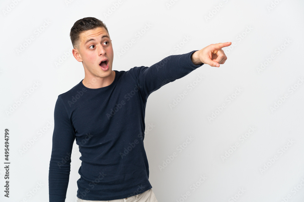 Young caucasian man isolated on white background pointing away Young caucasian man isolated on white background pointing away