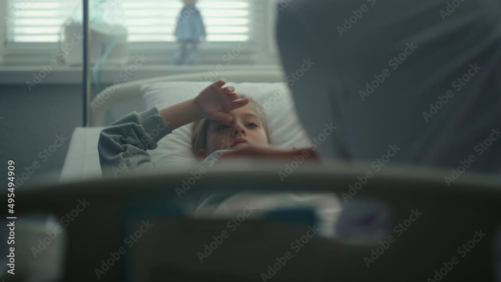 Sad girl lying hospital bed on daily medical examination in clinic portrait. Sad girl lying hospital bed on daily medical examination in clinic portrait.