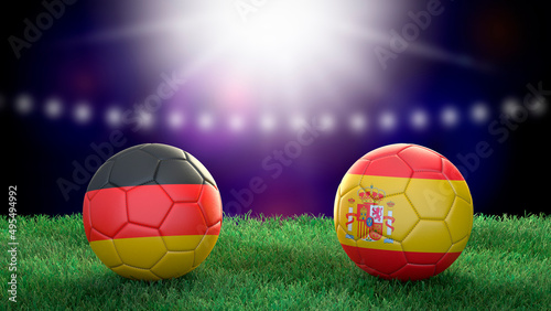 Two soccer balls in flags colors on stadium blurred background. Germany and Spain. 3d image