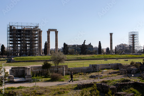 The Temple of Olympian Zeus also known as the Olympieion with ongoing maintenance works. Is a former colossal temple at the center of the Greek capital Athens. Sunny day with blue sky photo