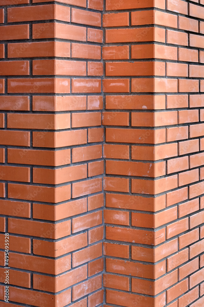 Bricks wall with different orange tones to be used as a background texture, digital graffiti or construction industry example. It is an image that shows solidity, strength, the human capacity. Bricks wall with different orange tones to be used as a background texture, digital graffiti or construction industry example. It is an image that shows solidity, strength, the human capacity.