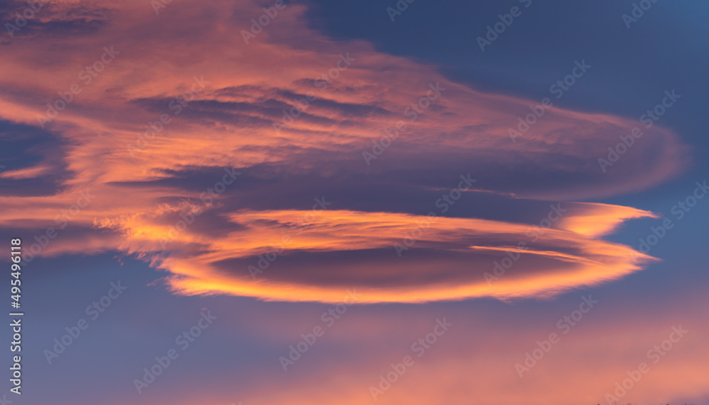 lenticular clouds at sunset