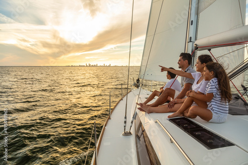 Latino family enjoying fun sailing adventures at sunrise © Spotmatik