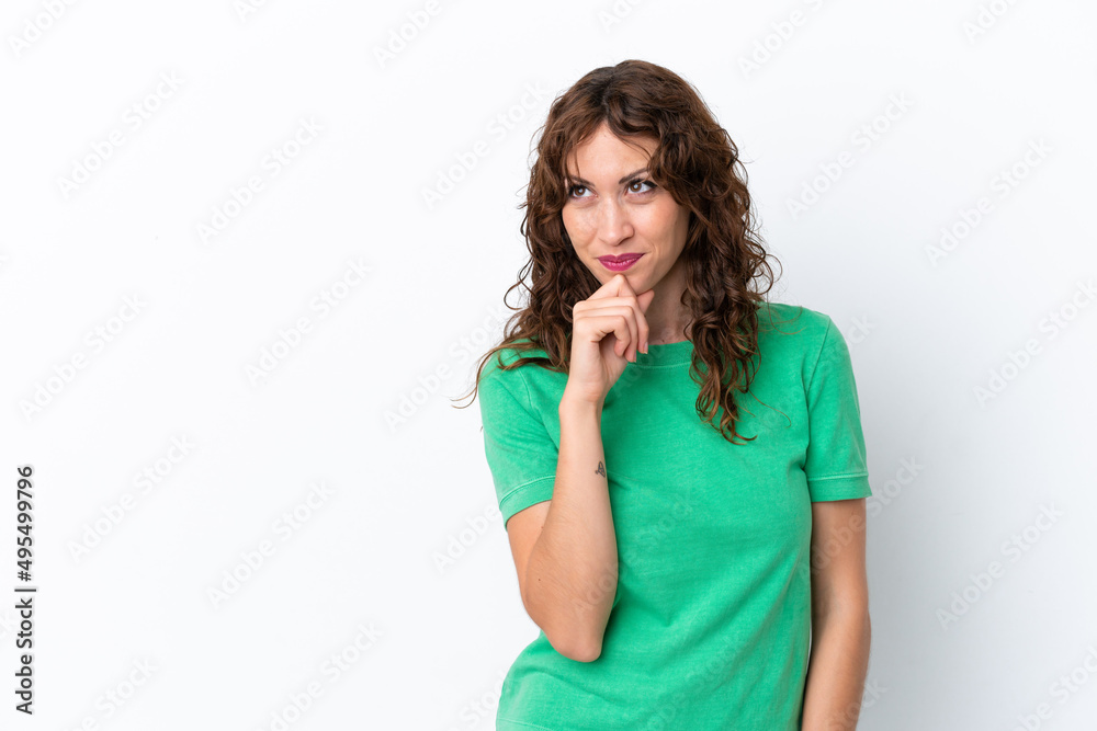 Young woman with curly hair isolated on white background and looking up Young woman with curly hair isolated on white background and looking up