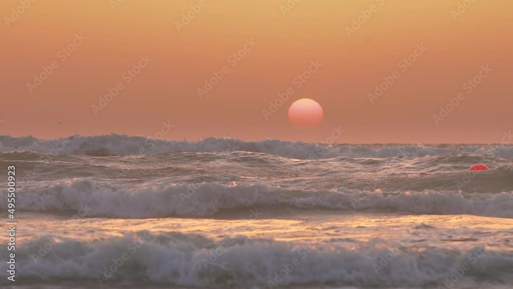 Sun Shine Above Sea Ocean During Sunset. Warm Colors Over Sea With Waves. Ocean Wave Water Foam Splashes Washing Beach At Sunset. Sundown Vacation Background. Tropical Resort Concept. Sun Shine Above Sea Ocean During Sunset. Warm Colors Over Sea With Waves. Ocean Wave Water Foam Splashes Washing Beach At Sunset. Sundown Vacation Background. Tropical Resort Concept.