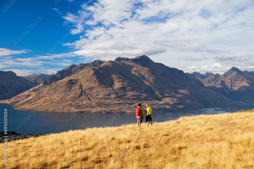 Young hikers viewing Lake Wakatipu Otago New Zealand
