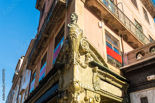 Portugal, Porto, Bust and carvings on building in old town