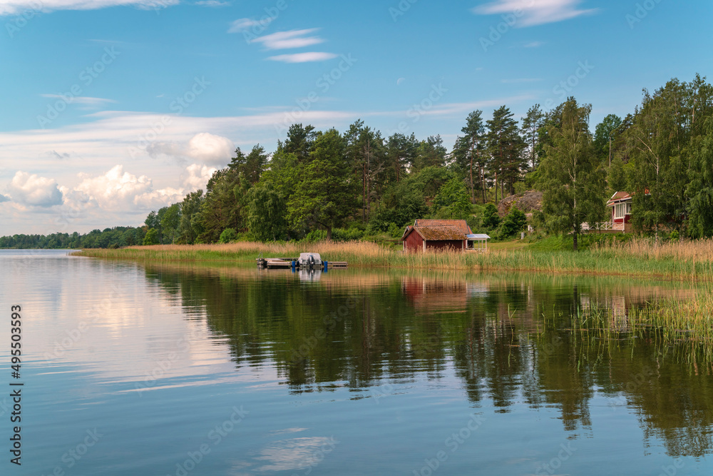 Obraz premium Sweden, Loftahammar, Small house on grassy coast