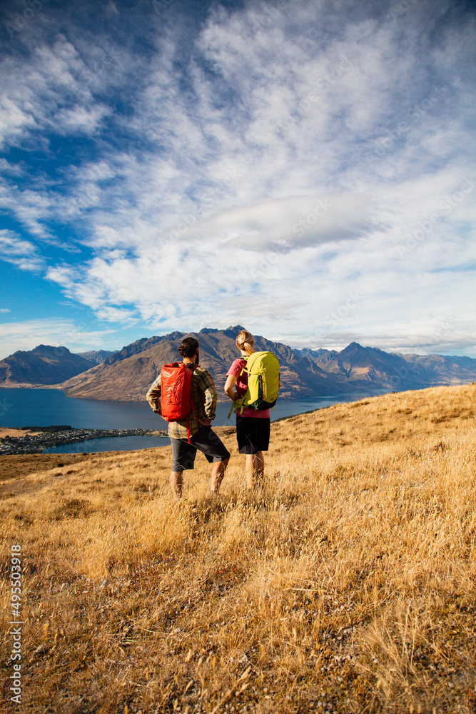 Couple hiking Lake Wakatipu South Island New Zealand