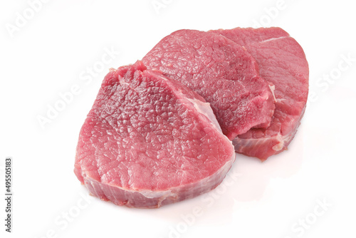 Fresh cut of beef on a white background. Raw steak beef meat fillet ready to cook. Selective focus