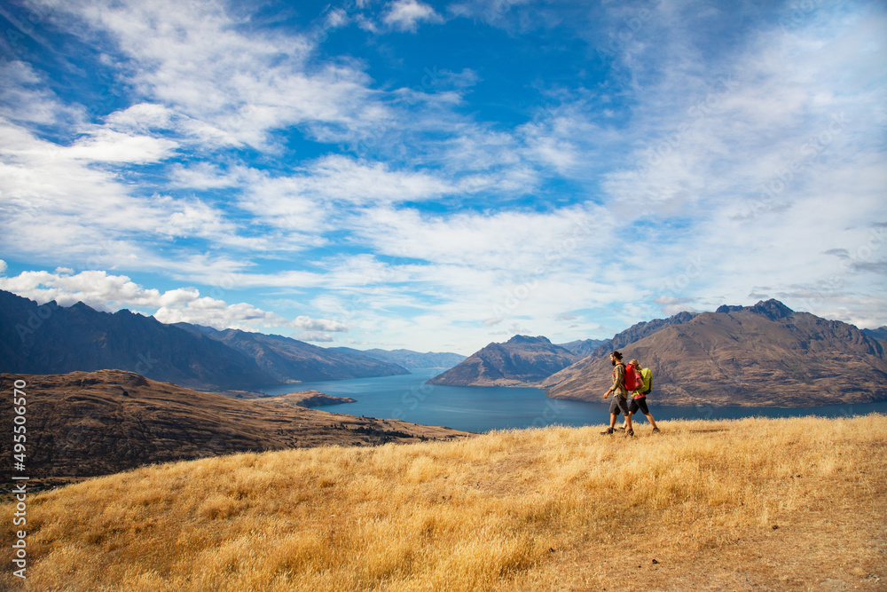 New Zealand trekking couple viewing Lake Wakatipu Otago