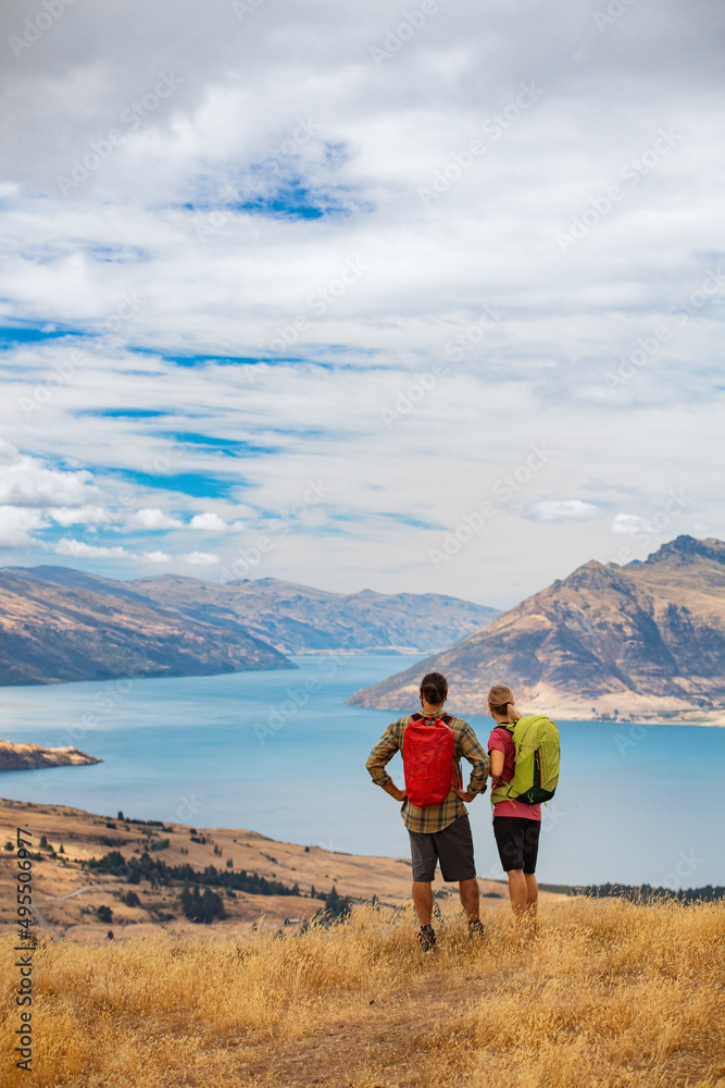 Lake Wakatipu couple walking on their travel holiday