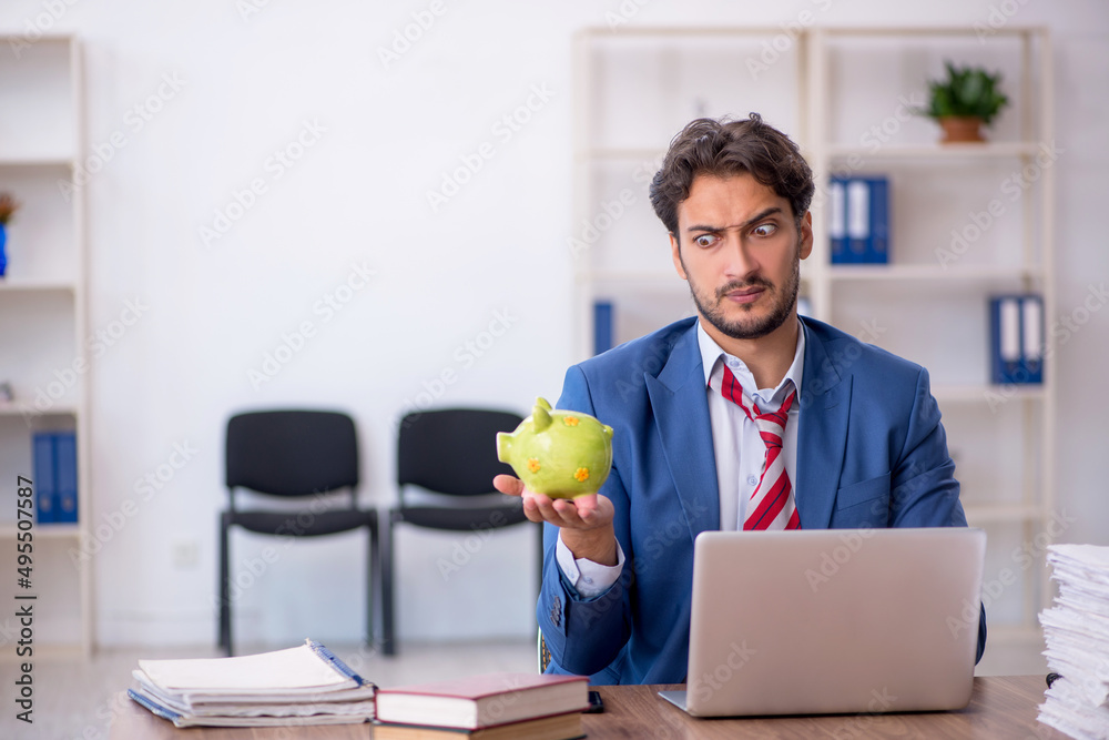 Young male employee in planning retirement concept