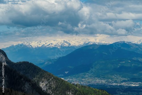 Mountain peak of Hahnkogel (Klek) with panoramic view in spring on the Karawanks, Carinthia, Austria. Borders Austria, Slovenia, Italy. Hohe Tauern Mountain Range. Alpine meadows