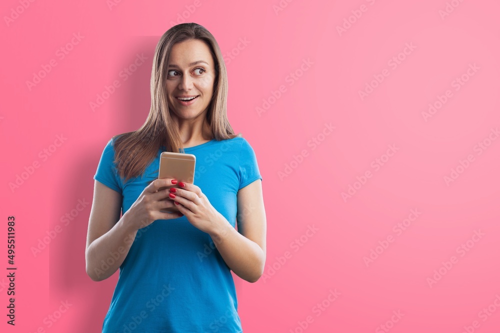 Young woman holding phone in hand and showing screen Young woman holding phone in hand and showing screen
