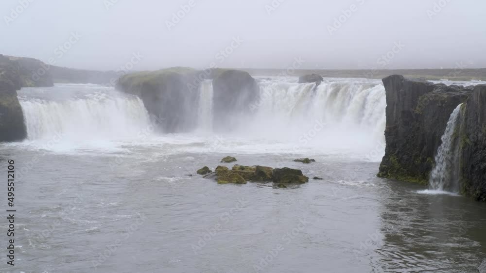 Picturesque full of water big waterfall Godafoss autumn dull day view, north Iceland. Picturesque full of water big waterfall Godafoss autumn dull day view, north Iceland.