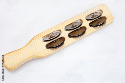 Wooden sistrum tambourine, isolated on white background