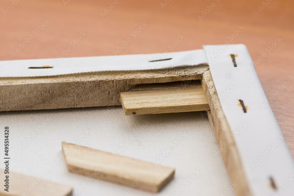 Artistic frame with canvas. Close-up of wooden spacers for stretching art canvas on a frame selective focus