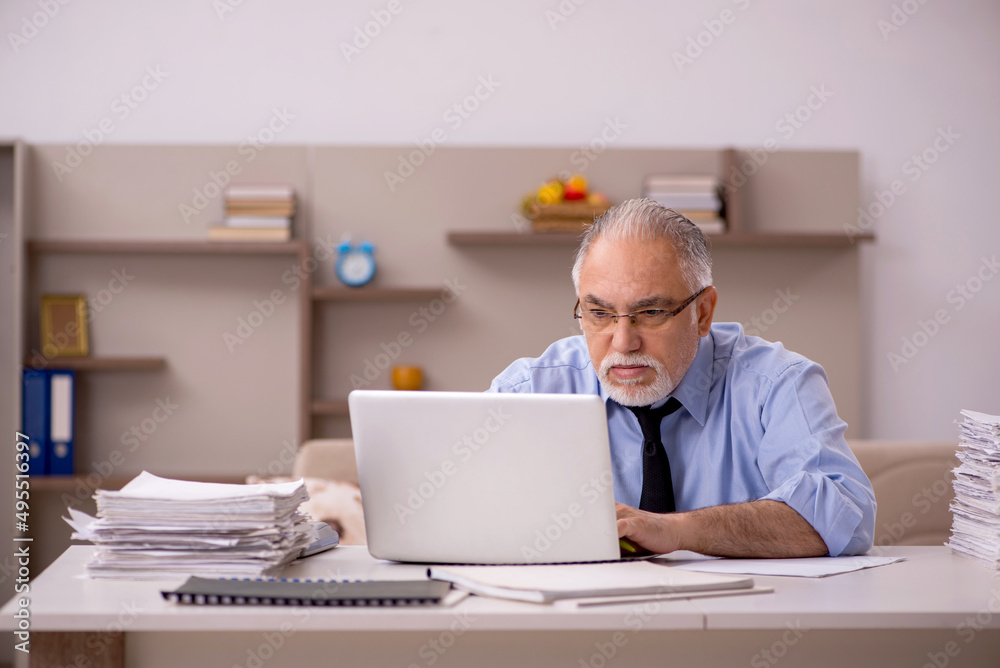 Old male boss working from home during pandemic Old male boss working from home during pandemic