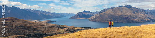 Panoramic travel hikers viewing Lake Wakatipu New Zealand