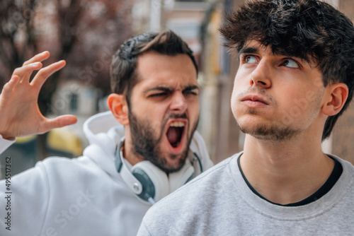 young people arguing in the street photo