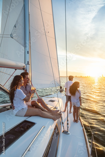Hispanic family enjoying vacation on yacht at sunset © Spotmatik