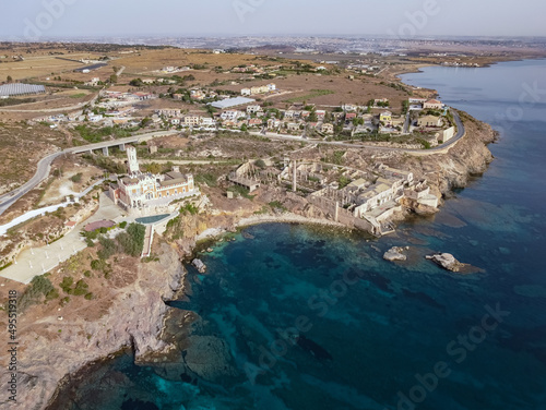 Aerial drone. Rocky coastline and island at Portopalo di Capo Passero, Siracusa Province, Sicily.