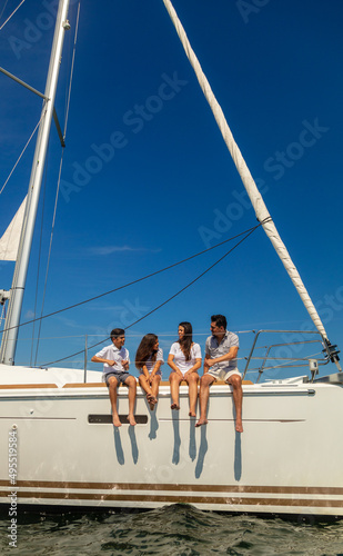 Latino family on luxury yacht enjoying Summer vacation