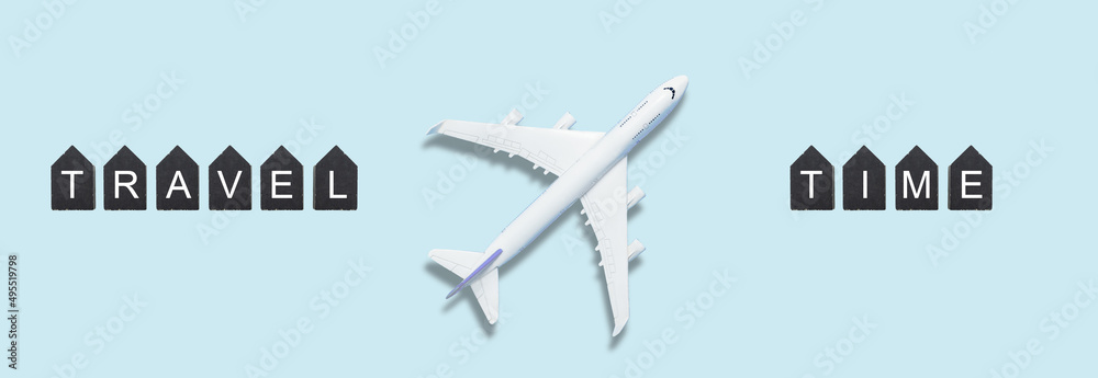 Airplane model. White plane on background. Travel vacation concept. Summer background. Flat lay, top view, copy space.