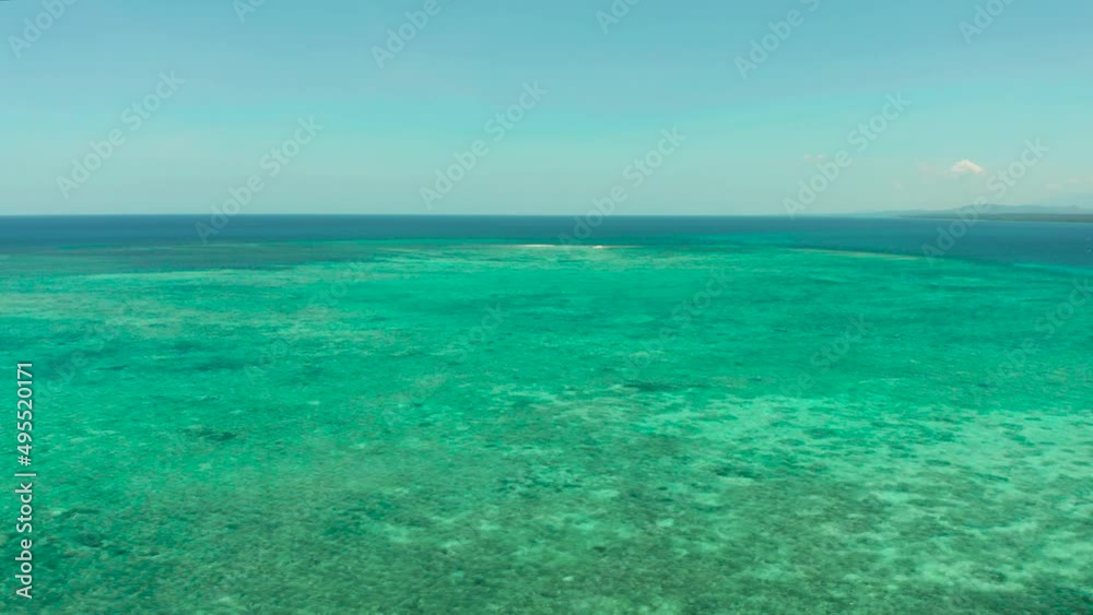 Sea water surface in lagoon, copy space for text, aerial view. Top view transparent turquoise ocean water surface. background texture Sea water surface in lagoon, copy space for text, aerial view. Top view transparent turquoise ocean water surface. background texture