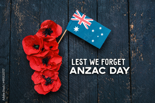 anzac day - Australian and New Zealand national public holiday, australian flag and poppy flowers memorial background