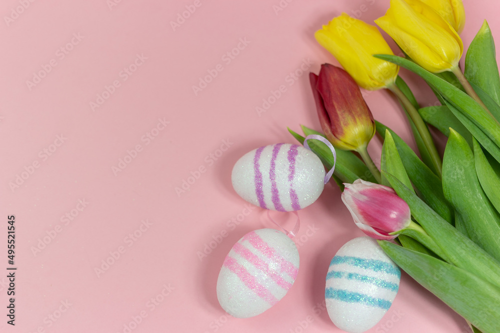 Easter border composition with Easter eggs and yellow and red tulips on a pink background. A stylish concept of minimalist decor. Space for copying. Festive flat banner with greeting card Easter border composition with Easter eggs and yellow and red tulips on a pink background. A stylish concept of minimalist decor. Space for copying. Festive flat banner with greeting card