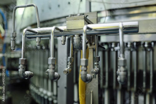 modern equipment for filling beer, carbonated drinks, water in bottles.