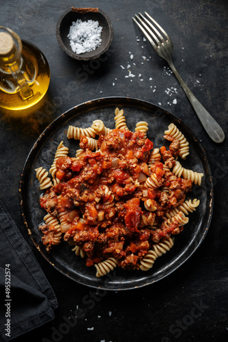 Pasta bolognese with vegetables on plate