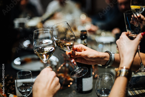 Champagne glasses and glasses of wine in hands of people at party.