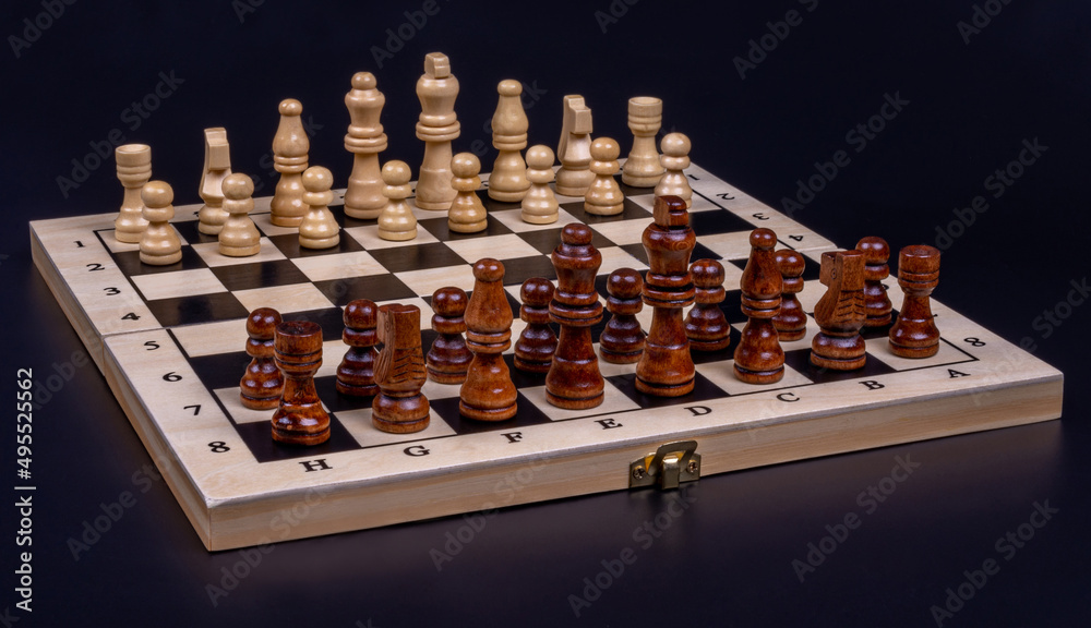 photo of a chessboard with placed pieces photo of a chessboard with placed pieces