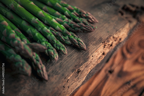 asparagus's tip on top of a old chopping board