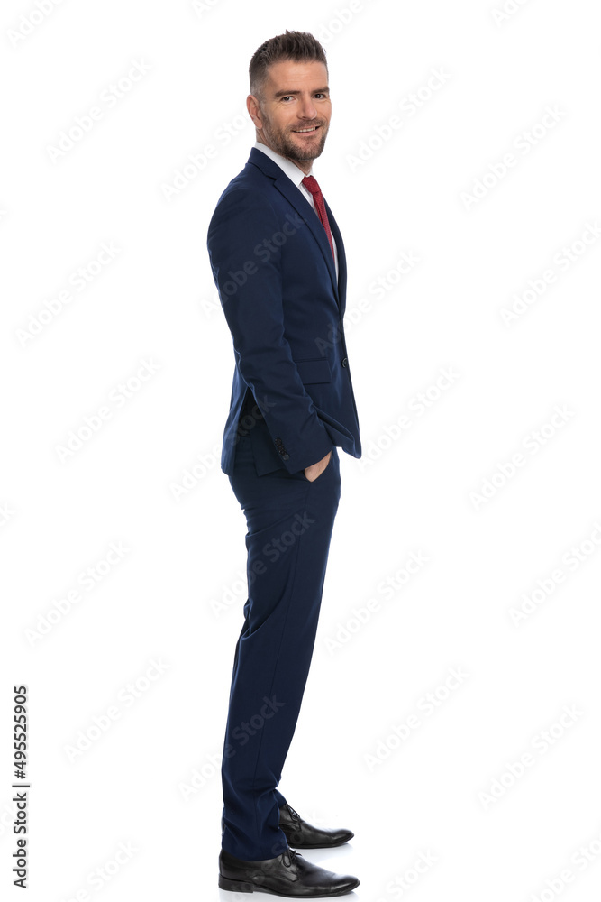 businessman holding hands in pocket and smiling at the camera businessman holding hands in pocket and smiling at the camera