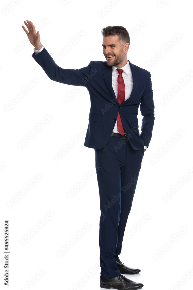 attractive businessman turning around to salute someone