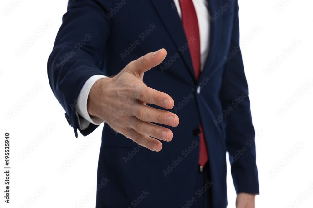 closeup on a businessman's hand ready to shake hands