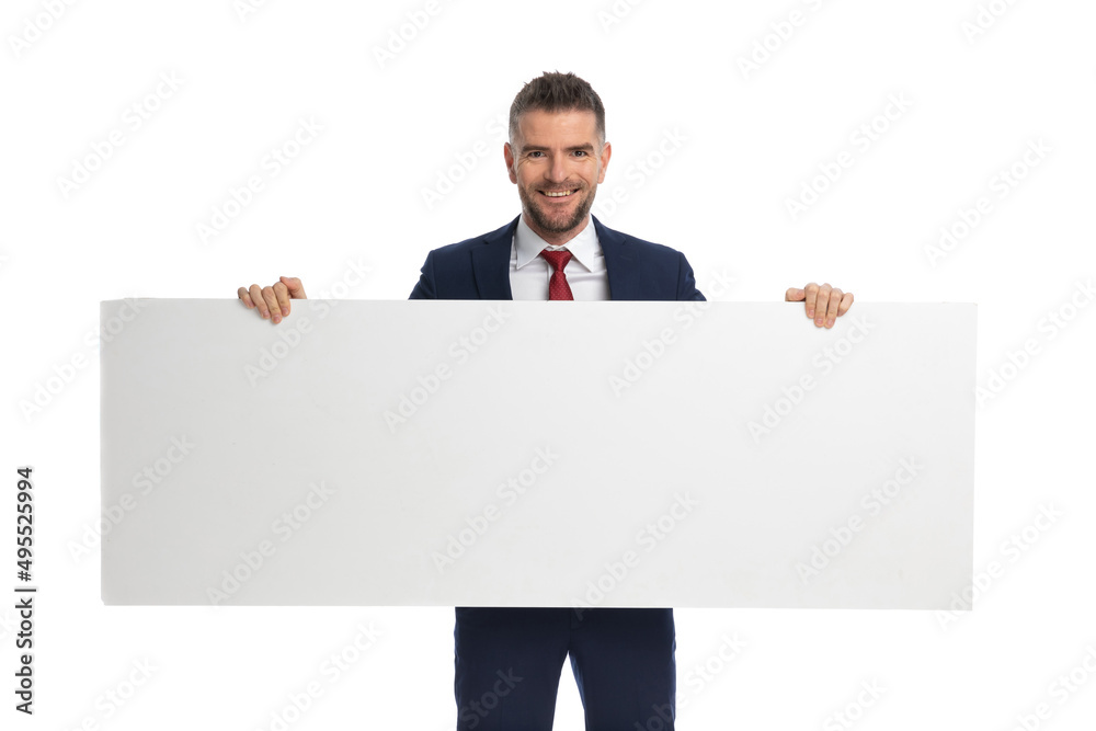 businessman feeling happy to present us his blank billboard businessman feeling happy to present us his blank billboard