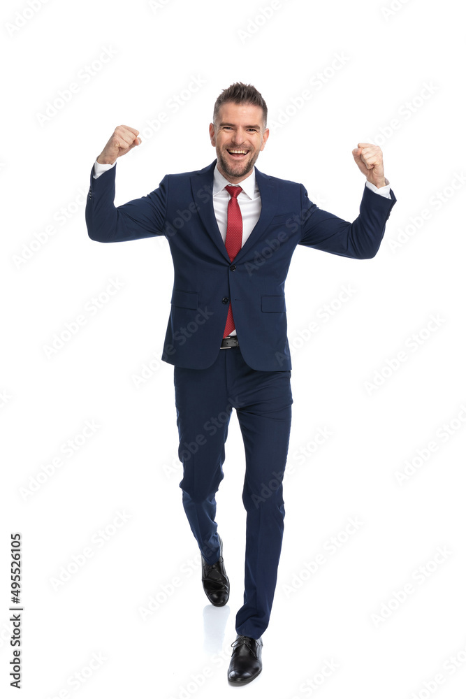 businessman celebrating the victory with his arms in the air businessman celebrating the victory with his arms in the air