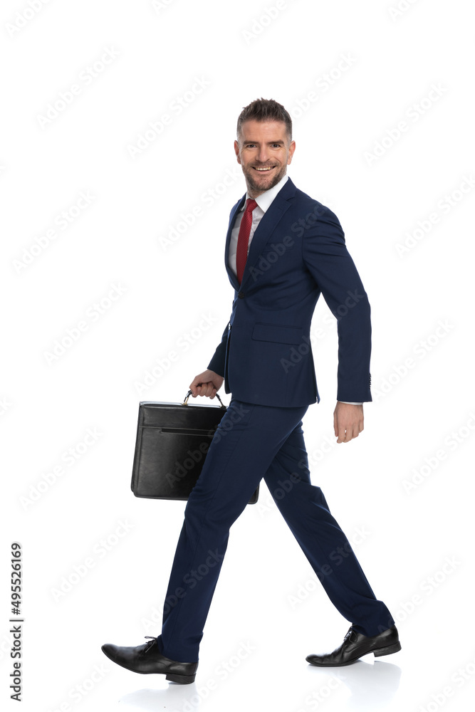 businessman walking with a smile on his face businessman walking with a smile on his face