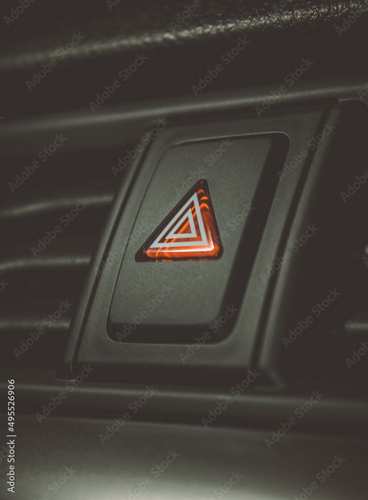 Emergency button and air vehicle control. Emergency button on the car panel. Emergency lights switch in the car. Background, car emergency button. Emergency button and air vehicle control. Emergency button on the car panel. Emergency lights switch in the car. Background, car emergency button.