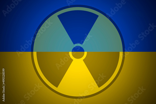 Radiation sign on the background of flag of Ukraine. The risk of nuclear war and radiation pollution