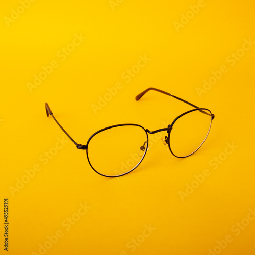 Eye glasses isolated on yellow background.