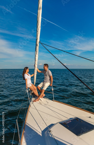 Latin American couple enjoying leisure time on yacht
