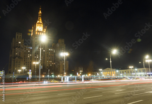 Moscow, Russia, Mar 3, 2022: Night view of Kudrinskaya square. Old soviet skyscraper. Traffic, Car traces. © olegkliucharev
