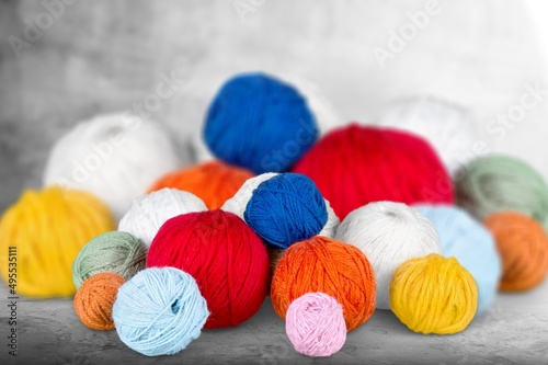 Skeins of yarn. Knitting needles, colorful threads. Knitting yarn for handmade winter clothes.