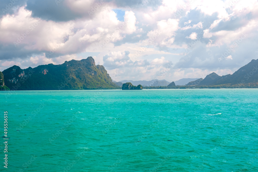 Seascape. Bizarre mountains in the province of Krabi in Thailand against the background of the sea, view from the ship.
